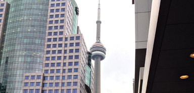 Students pose in front of the CN Tower in downtown Toronto.